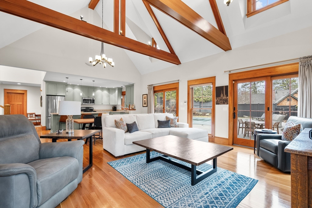 32 Standish Circle Wellesley, MA 02481 - Photo 4 of 29 a living room with furniture a rug potted plant and a large window