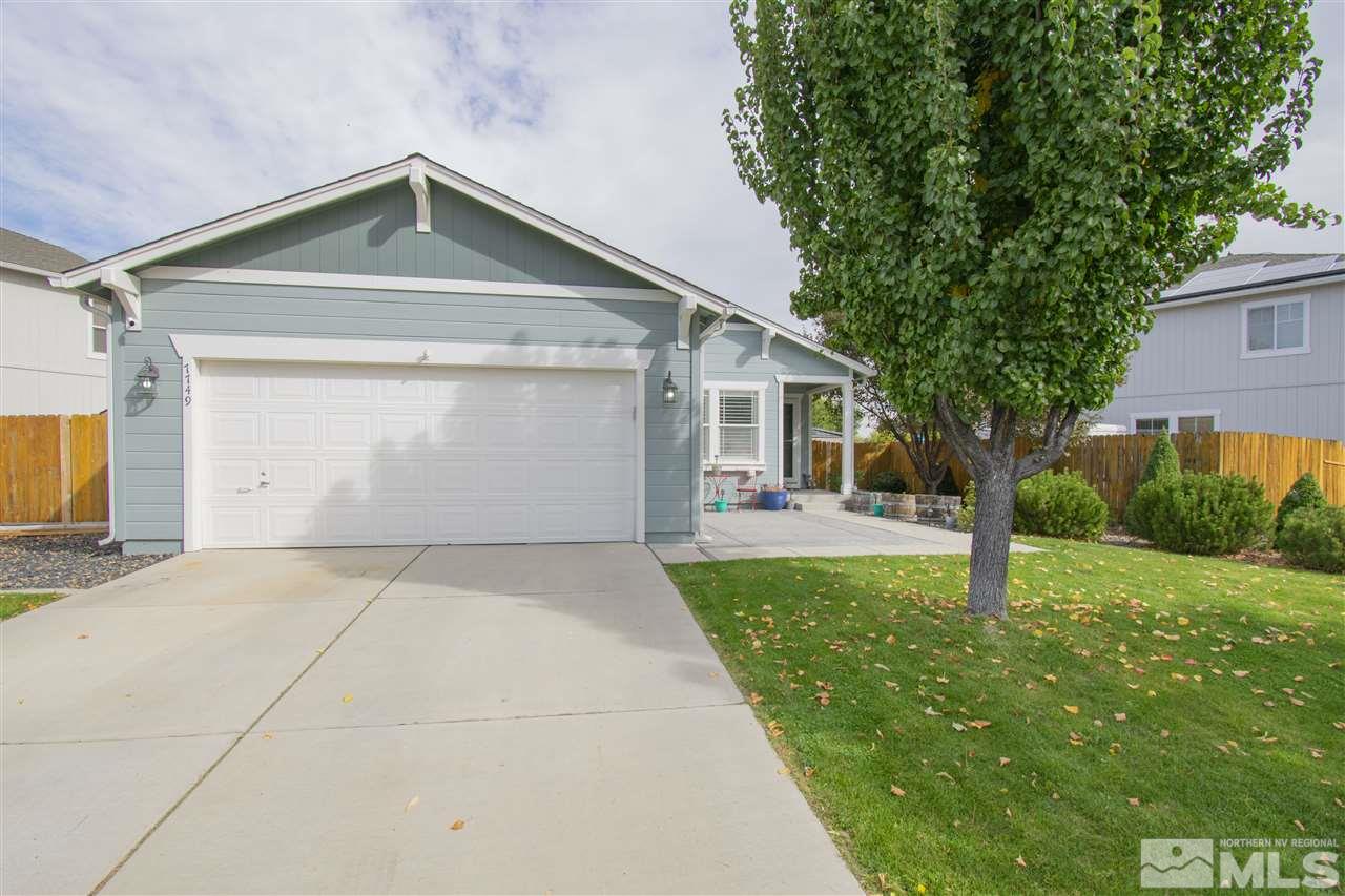 7749 Welsh Drive Reno, NV 89506 - Photo 1 of 25 a front view of a house with garden