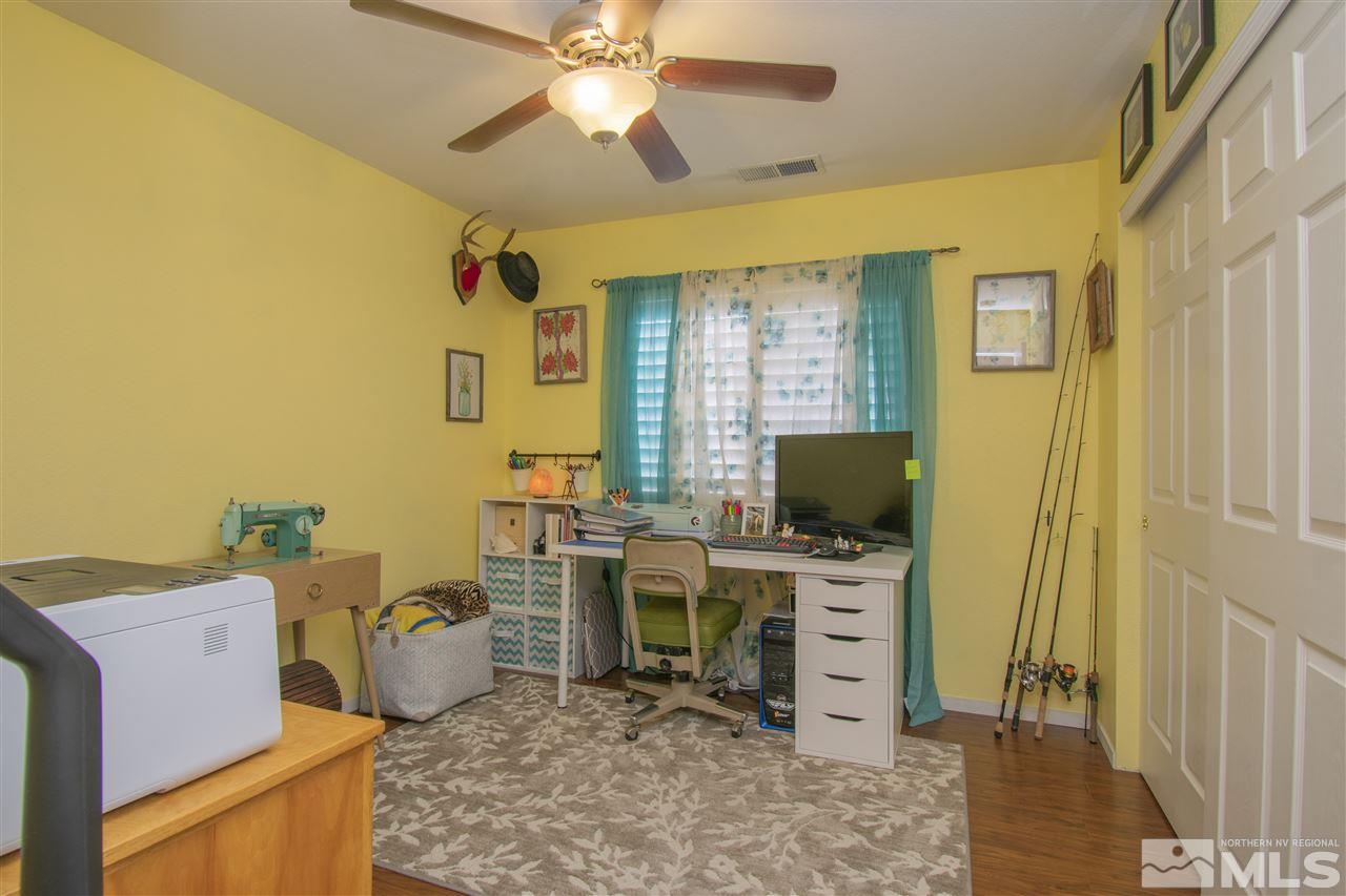 7749 Welsh Drive Reno, NV 89506 - Photo 11 of 25 a view of a workspace with furniture and a window