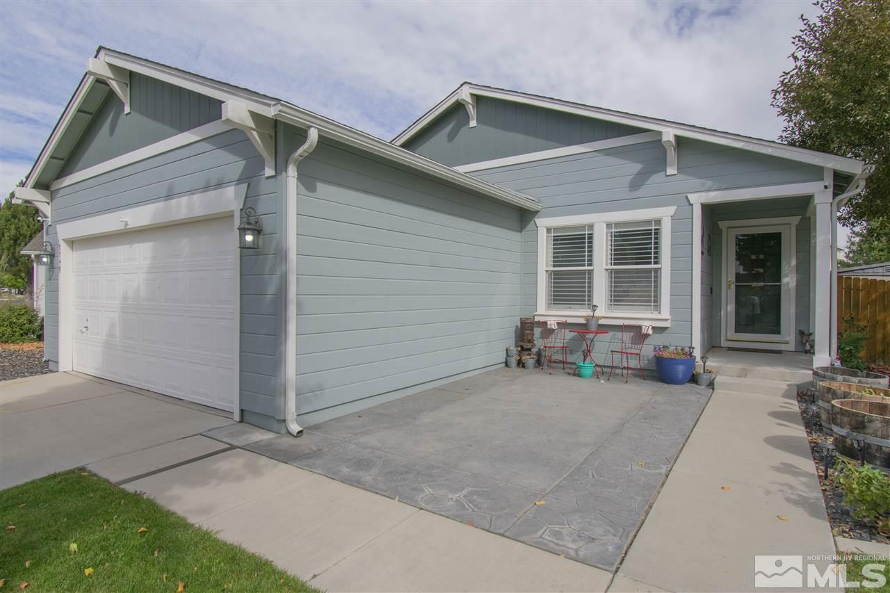 7749 Welsh Drive Reno, NV 89506 - Photo 2 of 25 a view of a house with lounge chair and a small yard