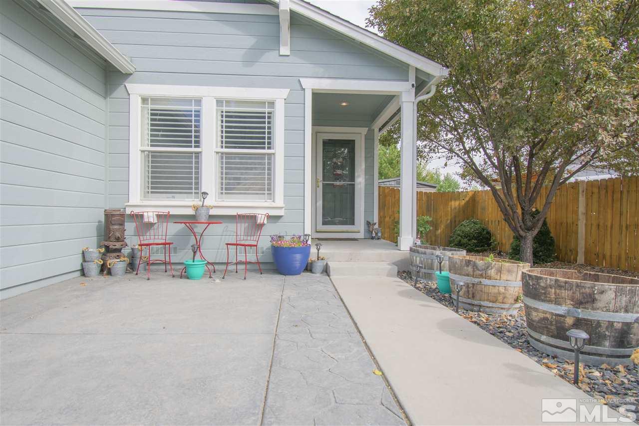 7749 Welsh Drive Reno, NV 89506 - Photo 3 of 25 a front view of house with outdoor seating