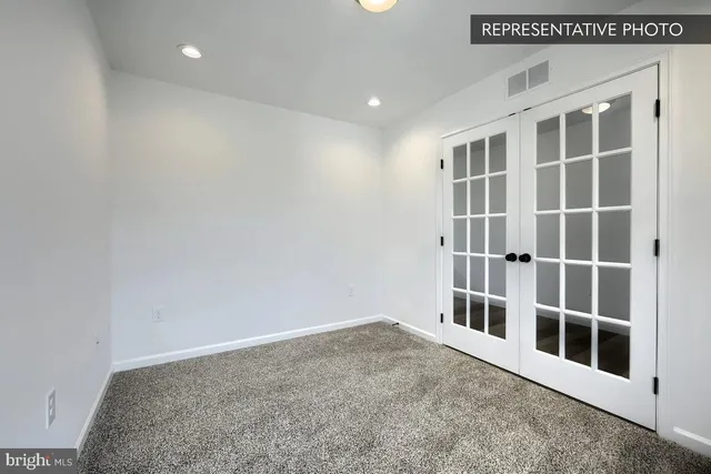 a view of empty room with windows