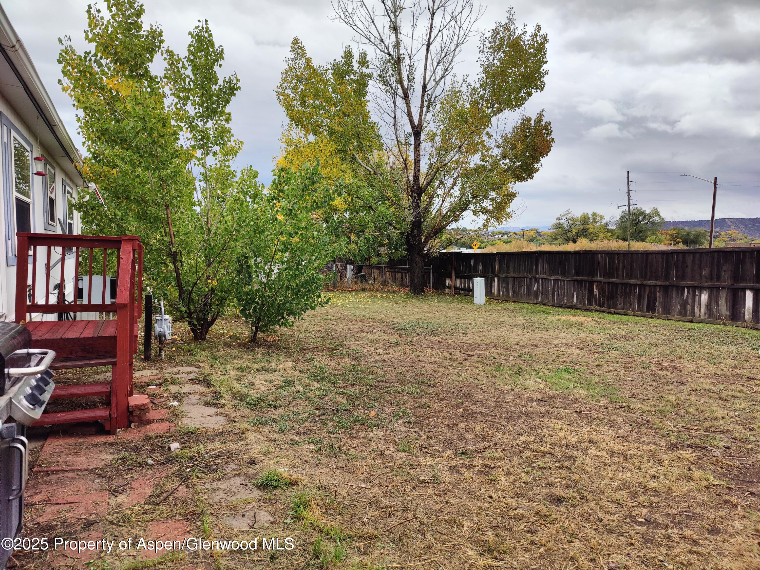 200 West 20th Street, Unit A 128 Rifle, CO 81650 - Photo 3 of 3 a front view of a house with a yard