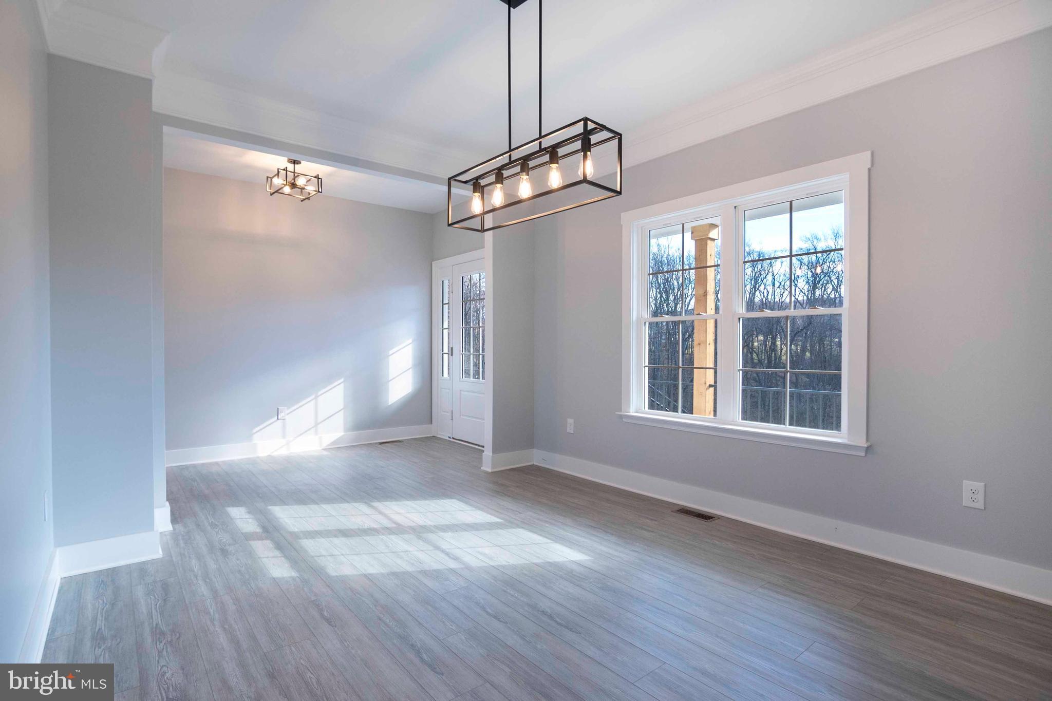 1633 Catlett Mountain Road Front Royal, VA 22630 - Photo 30 of 69 a view of empty room with wooden floor and fan