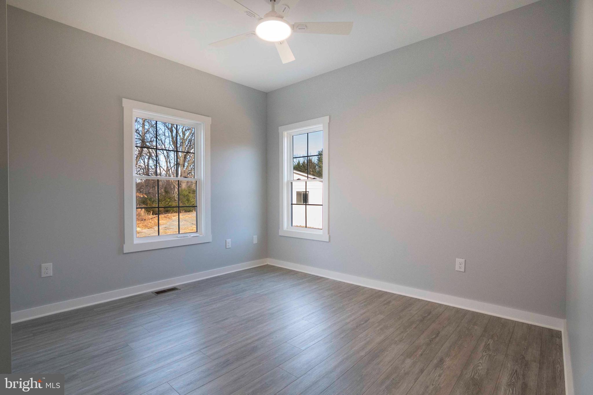 1633 Catlett Mountain Road Front Royal, VA 22630 - Photo 35 of 69 a view of an empty room with wooden floor and a window
