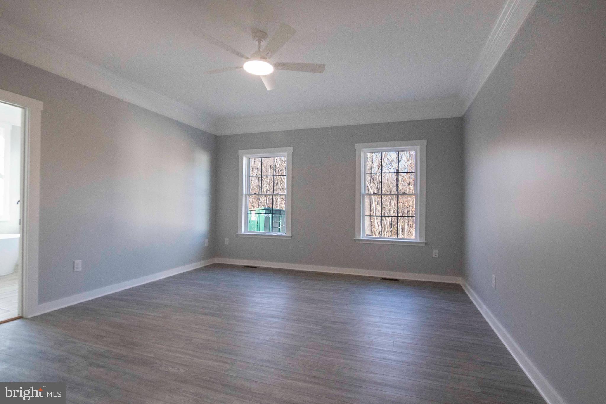 1633 Catlett Mountain Road Front Royal, VA 22630 - Photo 44 of 69 an empty room with wooden floor and windows