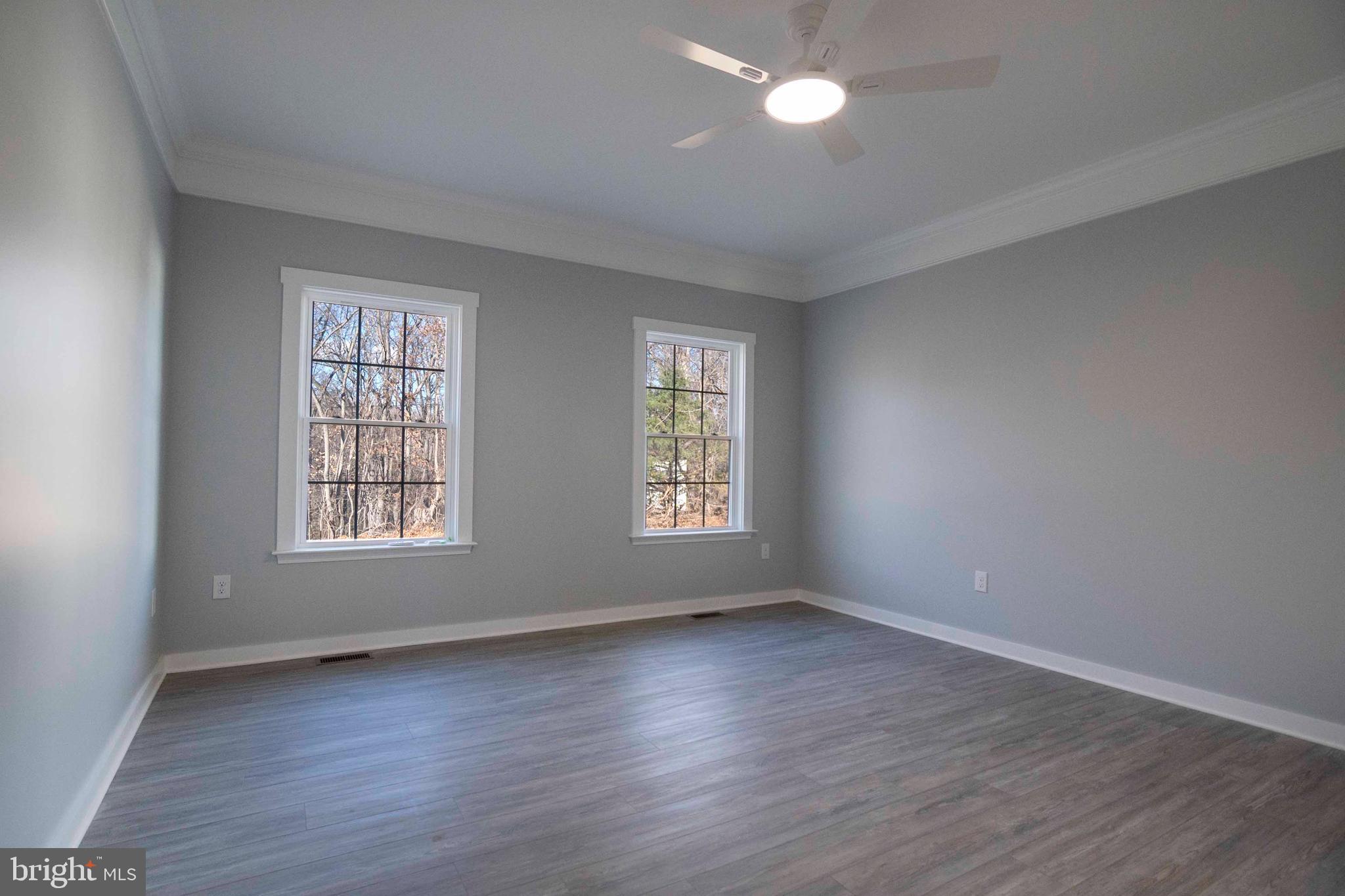 1633 Catlett Mountain Road Front Royal, VA 22630 - Photo 45 of 69 an empty room with wooden floor and windows