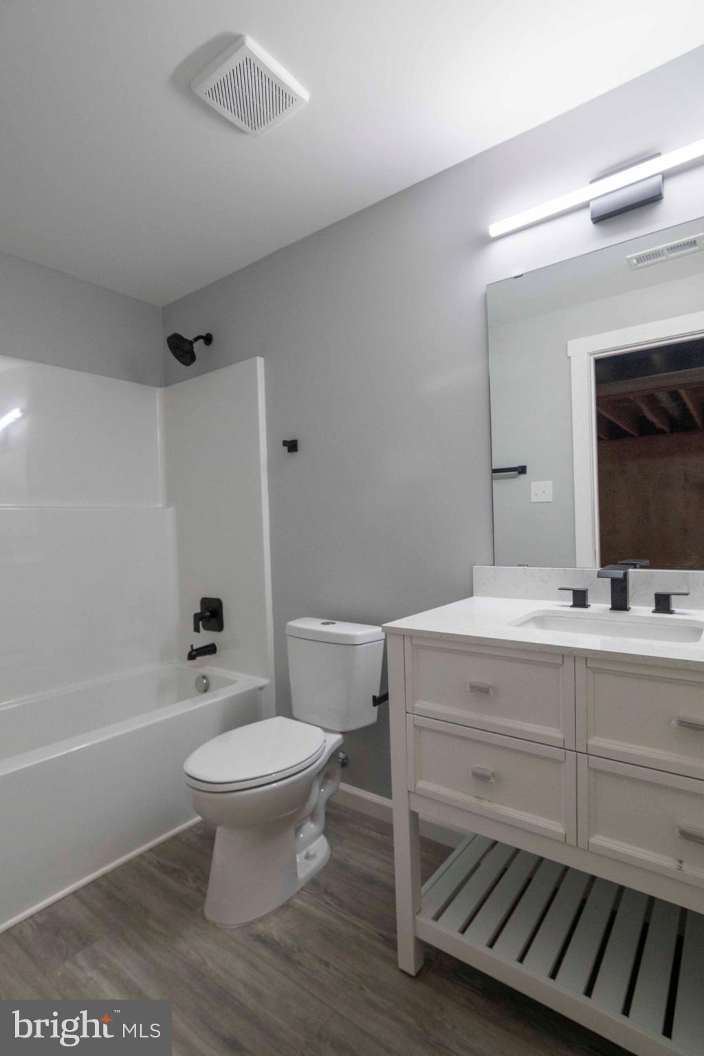 1633 Catlett Mountain Road Front Royal, VA 22630 - Photo 60 of 69 a bathroom with a sink toilet a mirror and shower