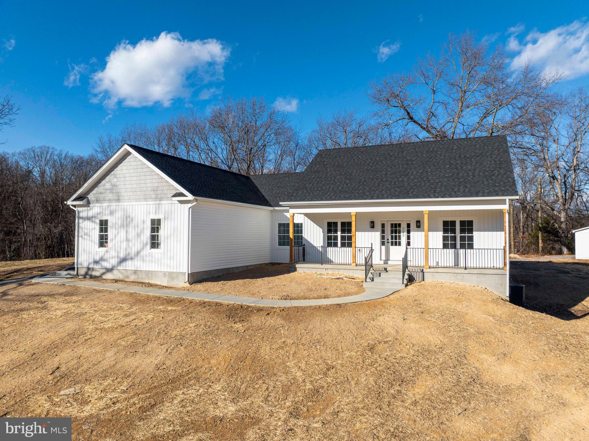 1633 Catlett Mountain Road Front Royal, VA 22630 - Photo 6 of 69 a front view of a house with a yard and garage