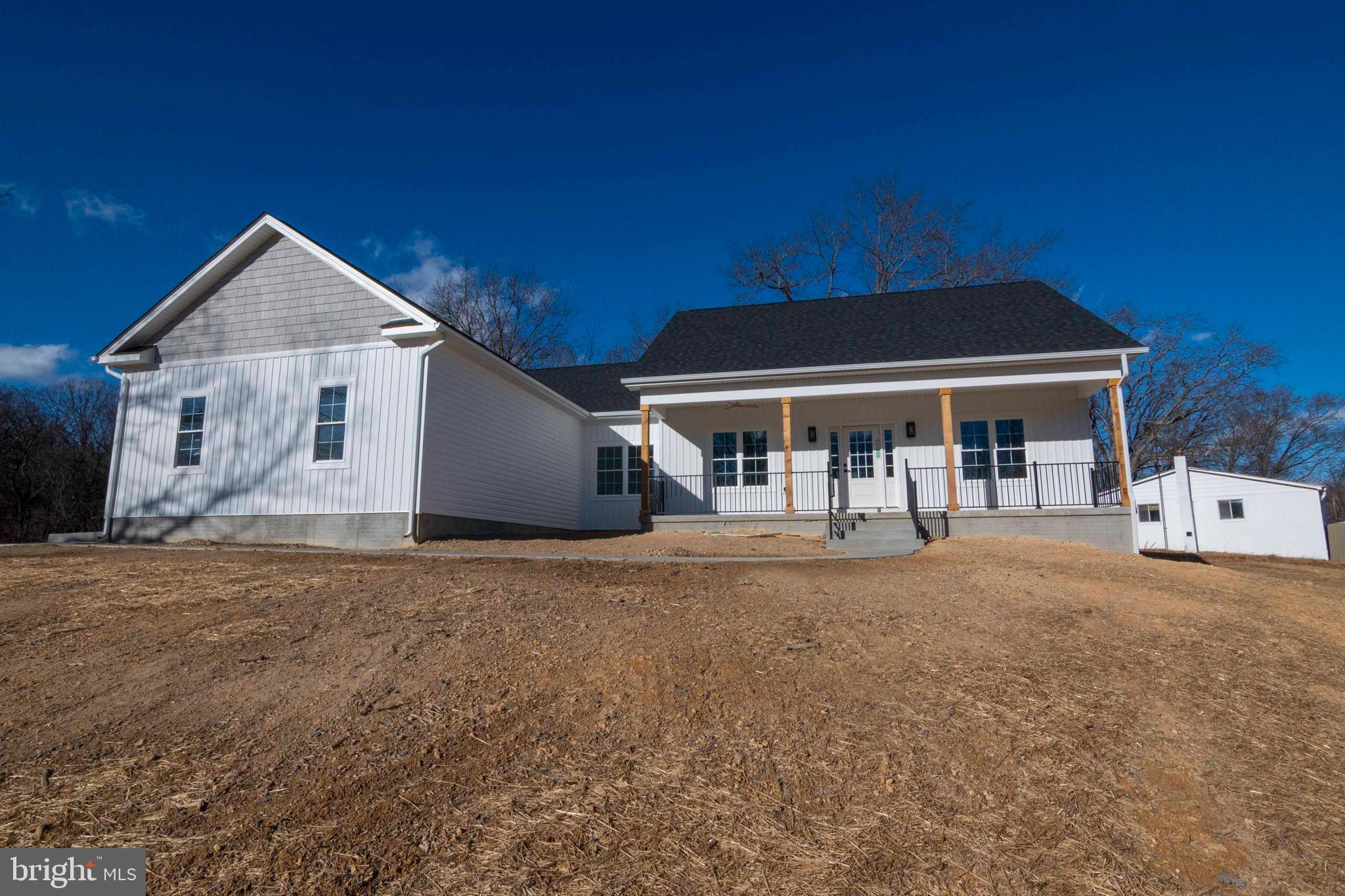 1633 Catlett Mountain Road Front Royal, VA 22630 - Photo 67 of 69 a front view of a house with a yard and garage