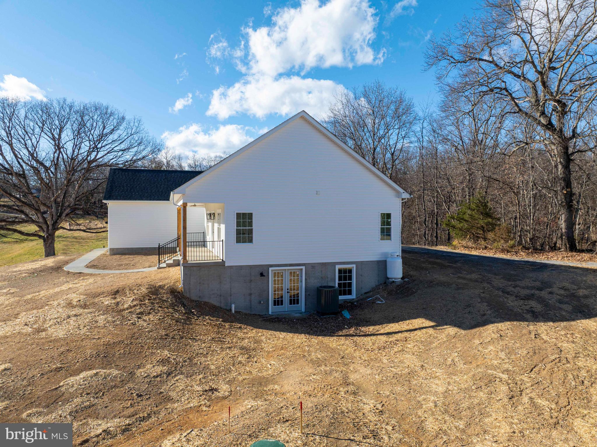 1633 Catlett Mountain Road Front Royal, VA 22630 - Photo 10 of 69 a view of a house with a yard covered in snow