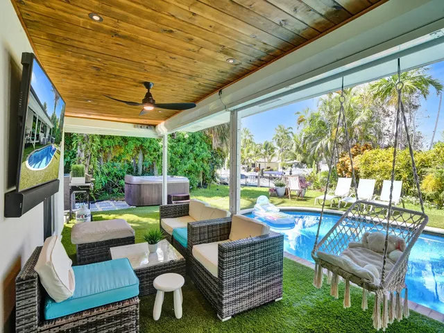 a view of a backyard with plants and a patio