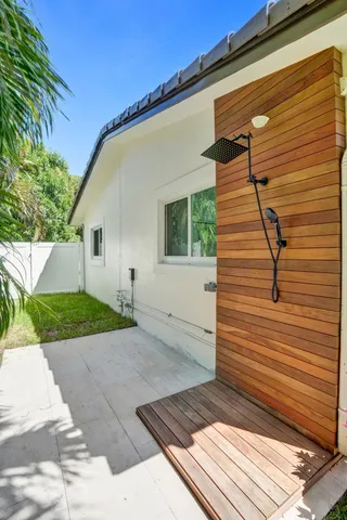 a swimming pool with outdoor seating yard and barbeque oven