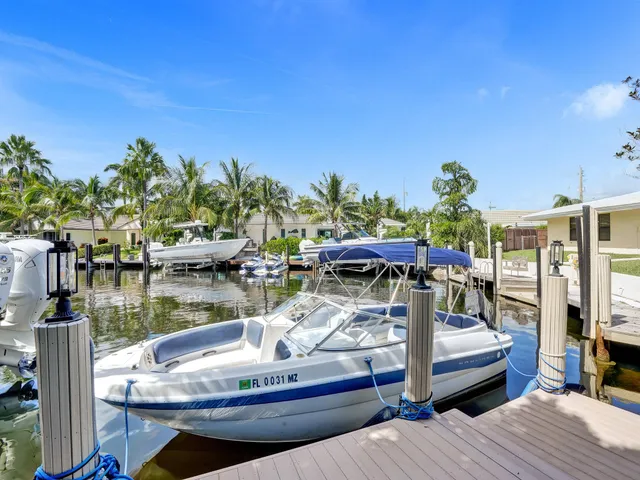 a bedroom with a bed and sliding window