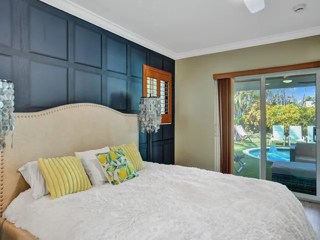 a kitchen with stainless steel appliances kitchen island granite countertop a stove and white cabinets