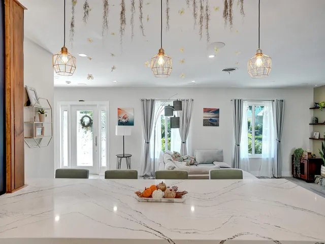 a bedroom with furniture and a chandelier