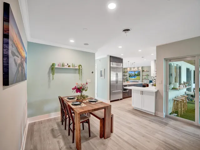 a spacious bathroom with double vanity and a bathtub