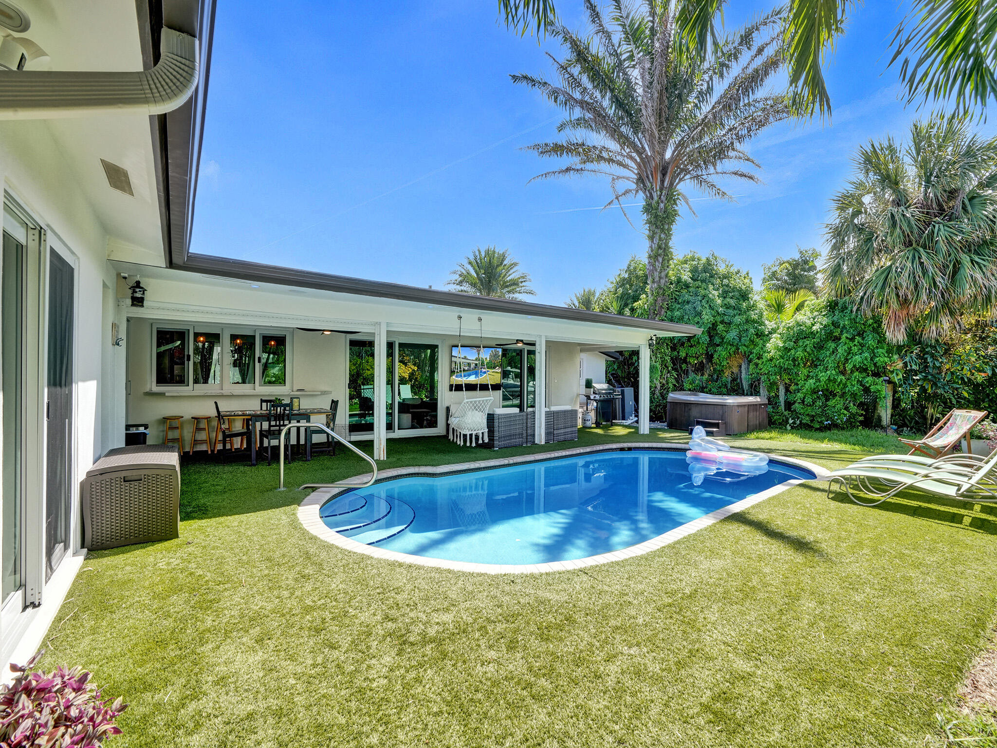 3821 Northeast 29th Avenue Lighthouse Point, FL 33064 - Photo 4 of 59 a view of a house with swimming pool and sitting area