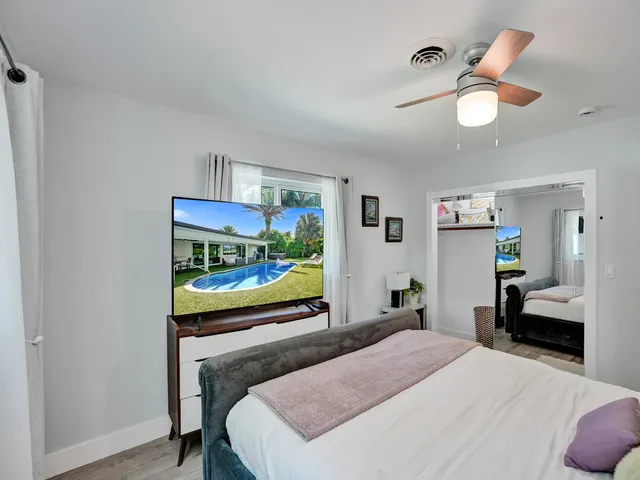 a kitchen with stainless steel appliances a stove and a wooden cabinets