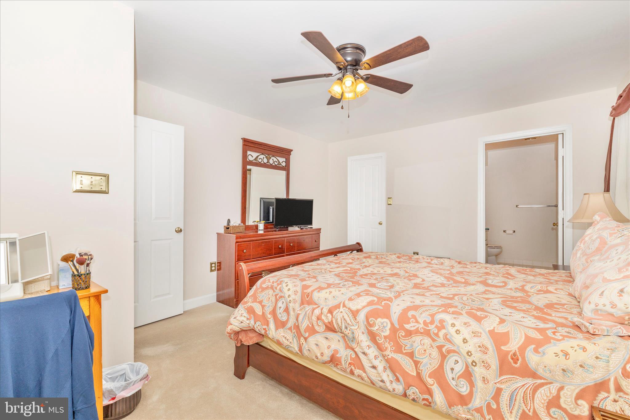 2367 Bear Den Road Frederick, MD 21701 - Photo 23 of 58 a bedroom with a bed and a chandelier