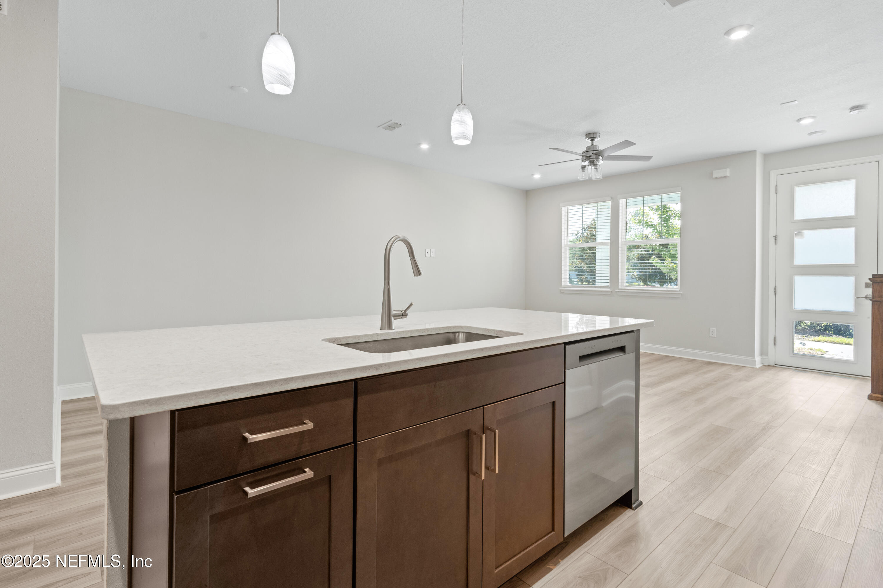 3524 Oystercatcher Way Jacksonville, FL 32224 - Photo 11 of 40 a kitchen with a sink cabinets and wooden floor