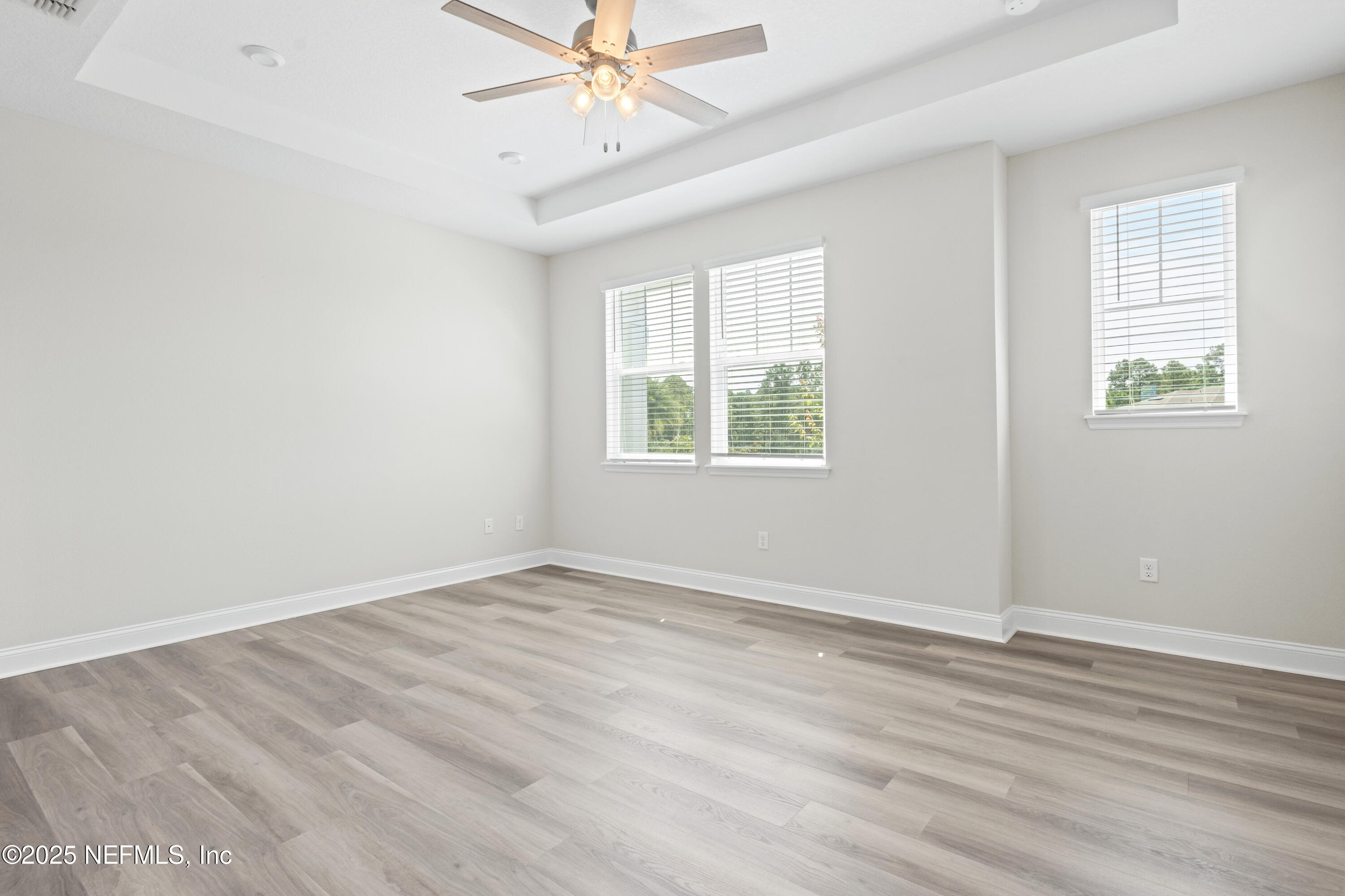 3524 Oystercatcher Way Jacksonville, FL 32224 - Photo 13 of 40 a view of an empty room with wooden floor and a window