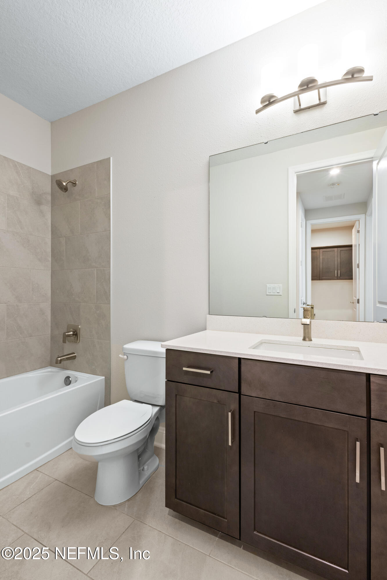 3524 Oystercatcher Way Jacksonville, FL 32224 - Photo 21 of 40 a bathroom with a sink a toilet and a mirror