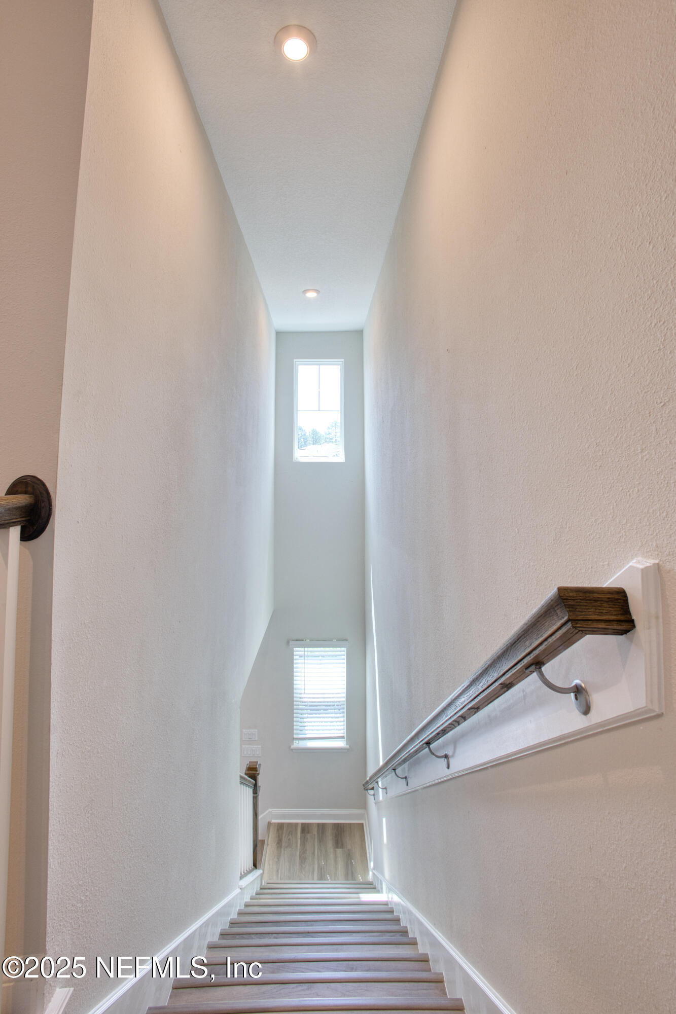 3524 Oystercatcher Way Jacksonville, FL 32224 - Photo 25 of 40 a view of a hallway with a white cabinet and a window