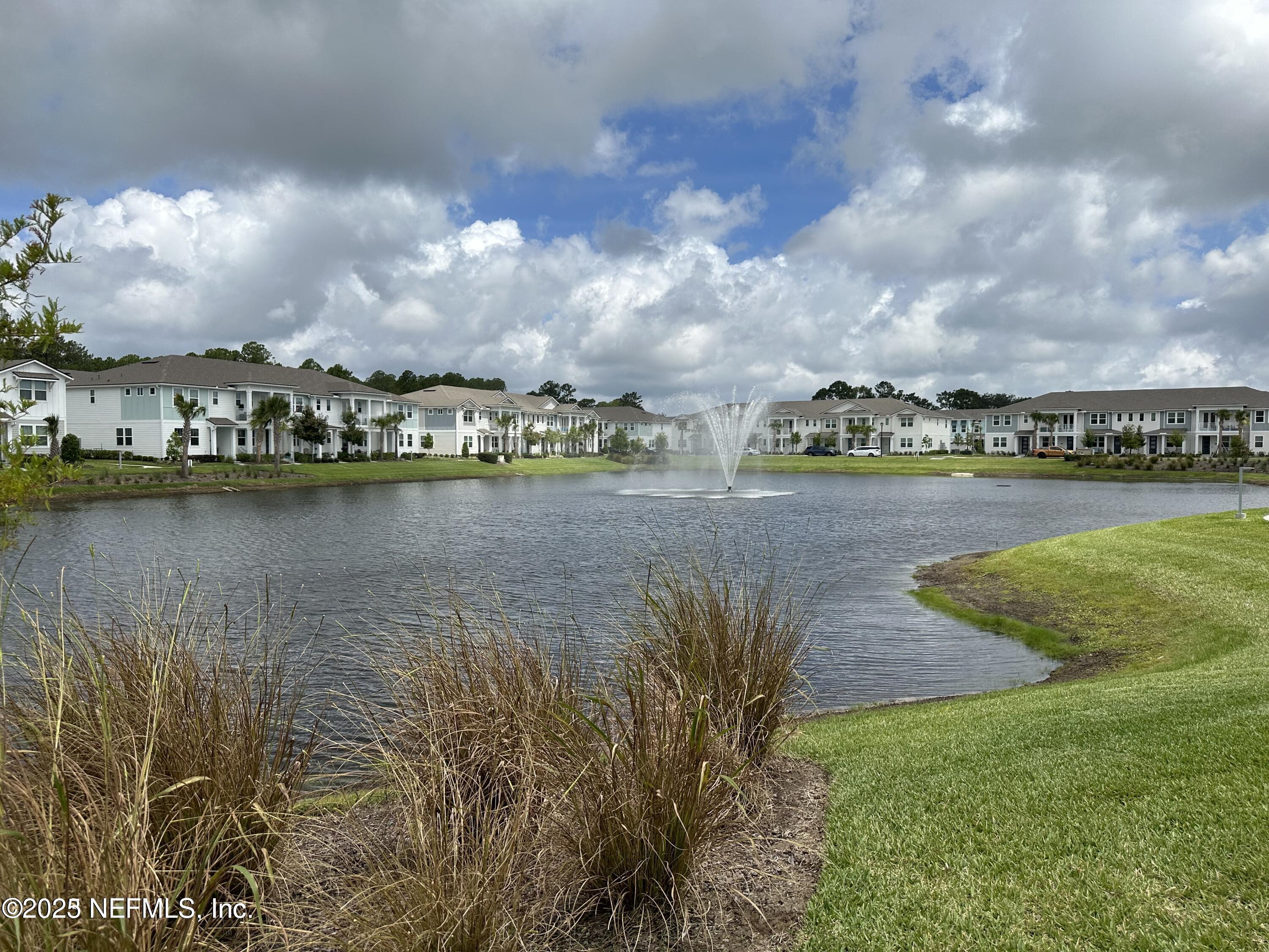 3524 Oystercatcher Way Jacksonville, FL 32224 - Photo 31 of 40 a view of a lake with houses in the back