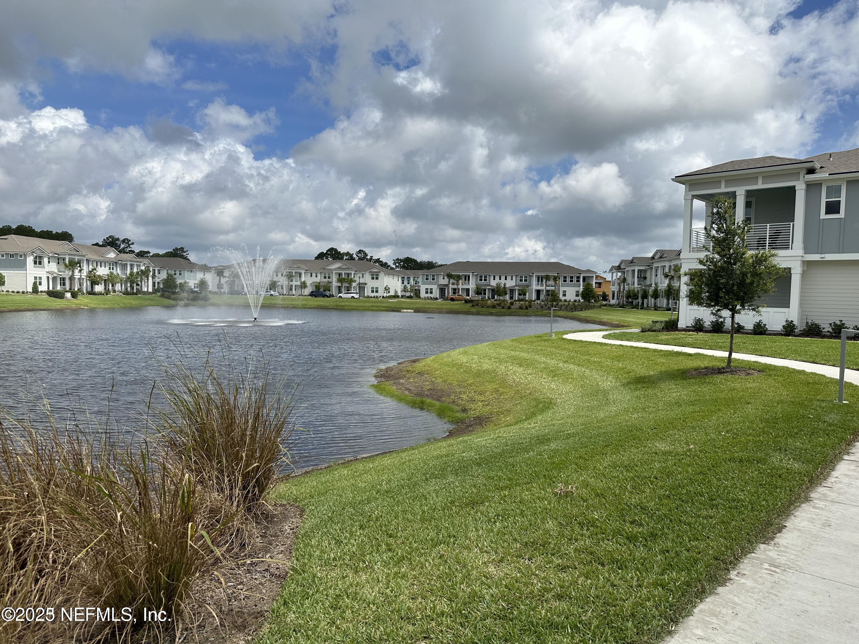 3524 Oystercatcher Way Jacksonville, FL 32224 - Photo 32 of 40 a view of a lake with a big yard and large trees