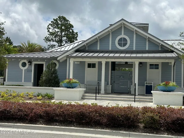a view of a table and chairs in the garden