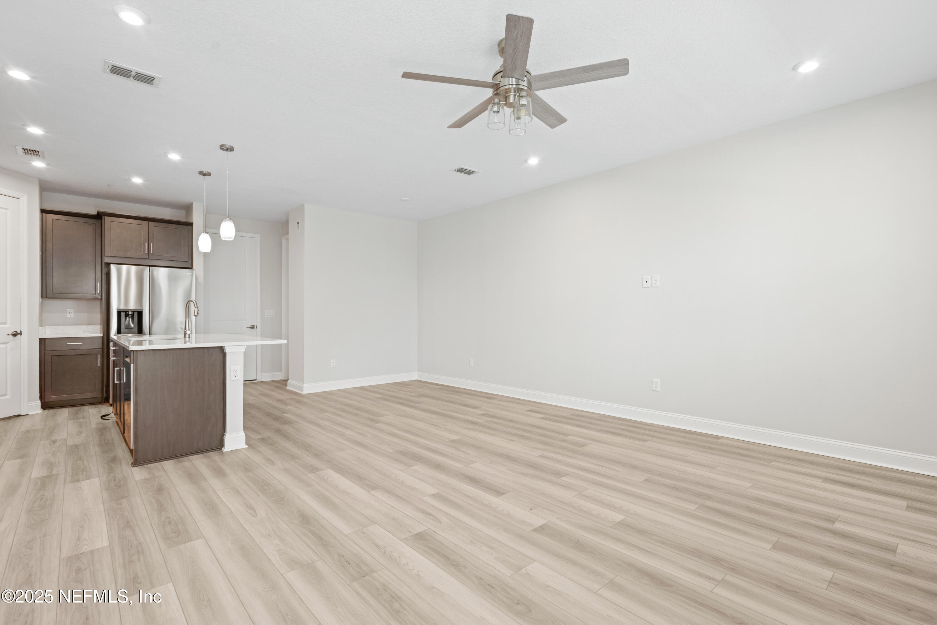 3524 Oystercatcher Way Jacksonville, FL 32224 - Photo 4 of 40 a view of a kitchen with a sink and wooden floor