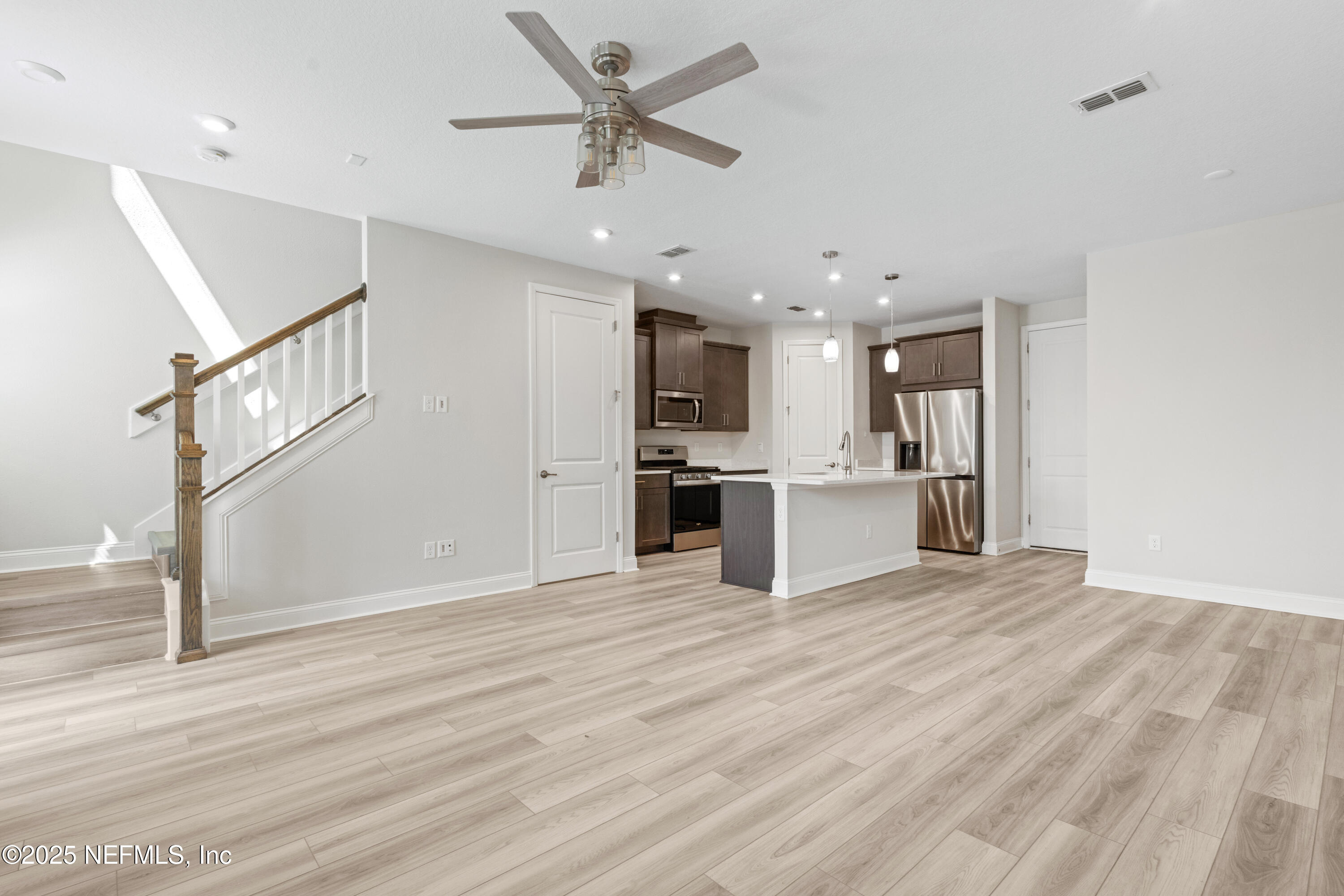 3524 Oystercatcher Way Jacksonville, FL 32224 - Photo 5 of 40 a view of a kitchen with a sink and a refrigerator