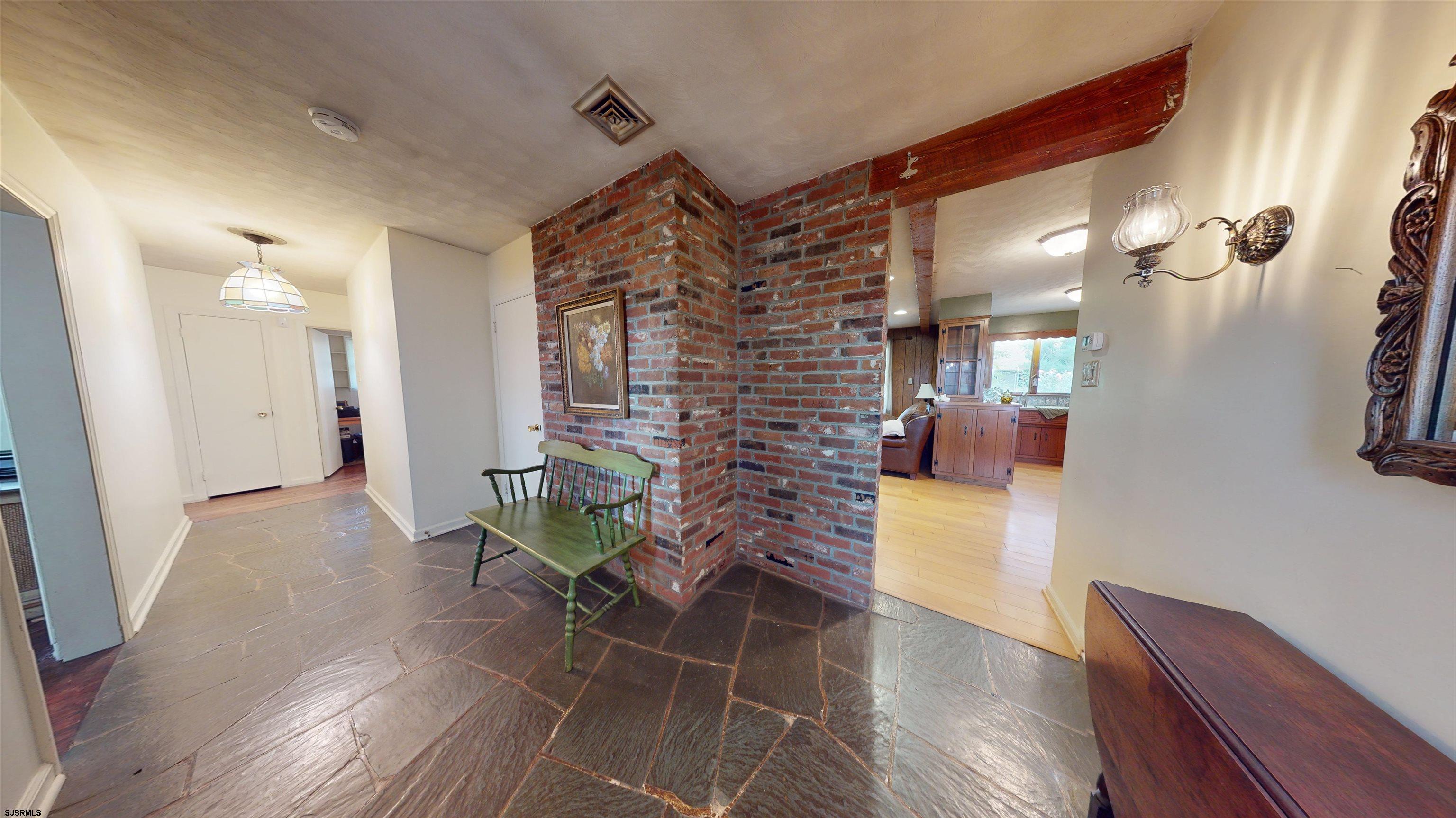 508 Lehigh Road South Glassboro, NJ 08028 - Photo 15 of 24 a view of a hallway with wooden floor and glass door