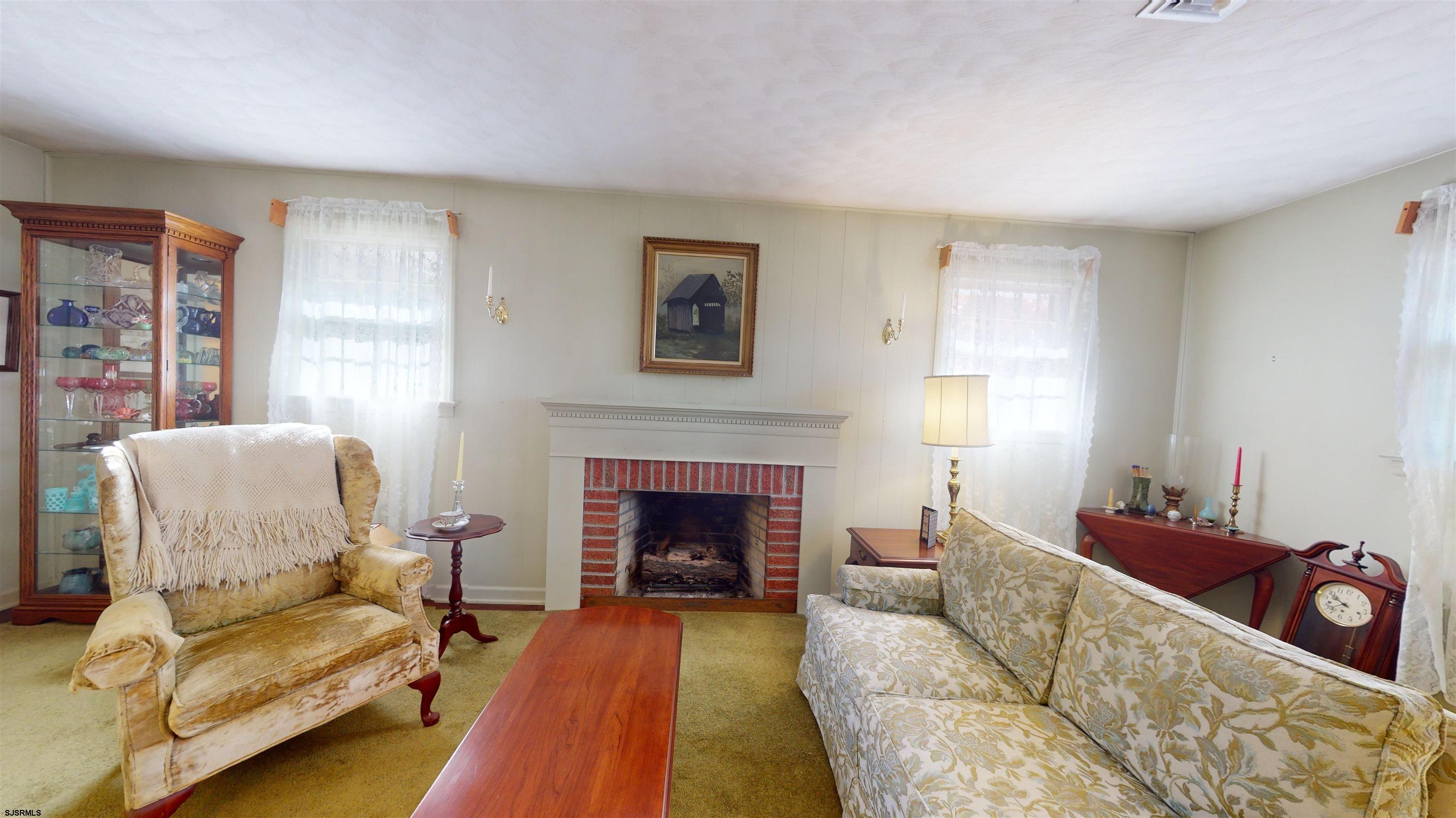508 Lehigh Road South Glassboro, NJ 08028 - Photo 19 of 24 a living room with furniture and a fireplace