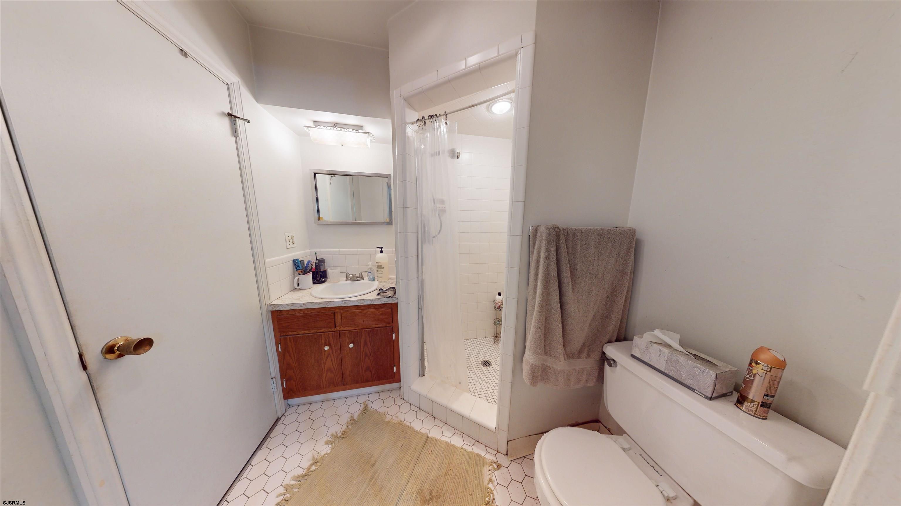 508 Lehigh Road South Glassboro, NJ 08028 - Photo 3 of 24 a bathroom with a sink and toilet