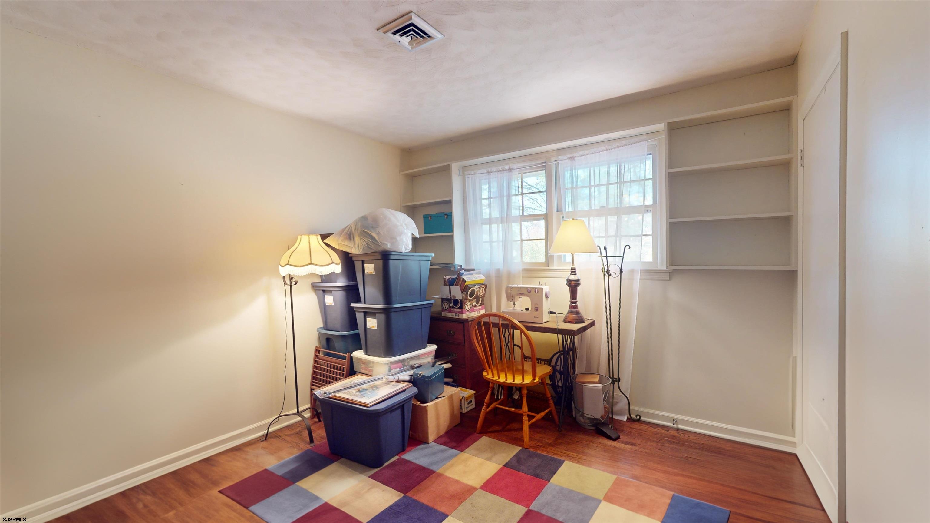 508 Lehigh Road South Glassboro, NJ 08028 - Photo 4 of 24 a view of a workspace with furniture and a window