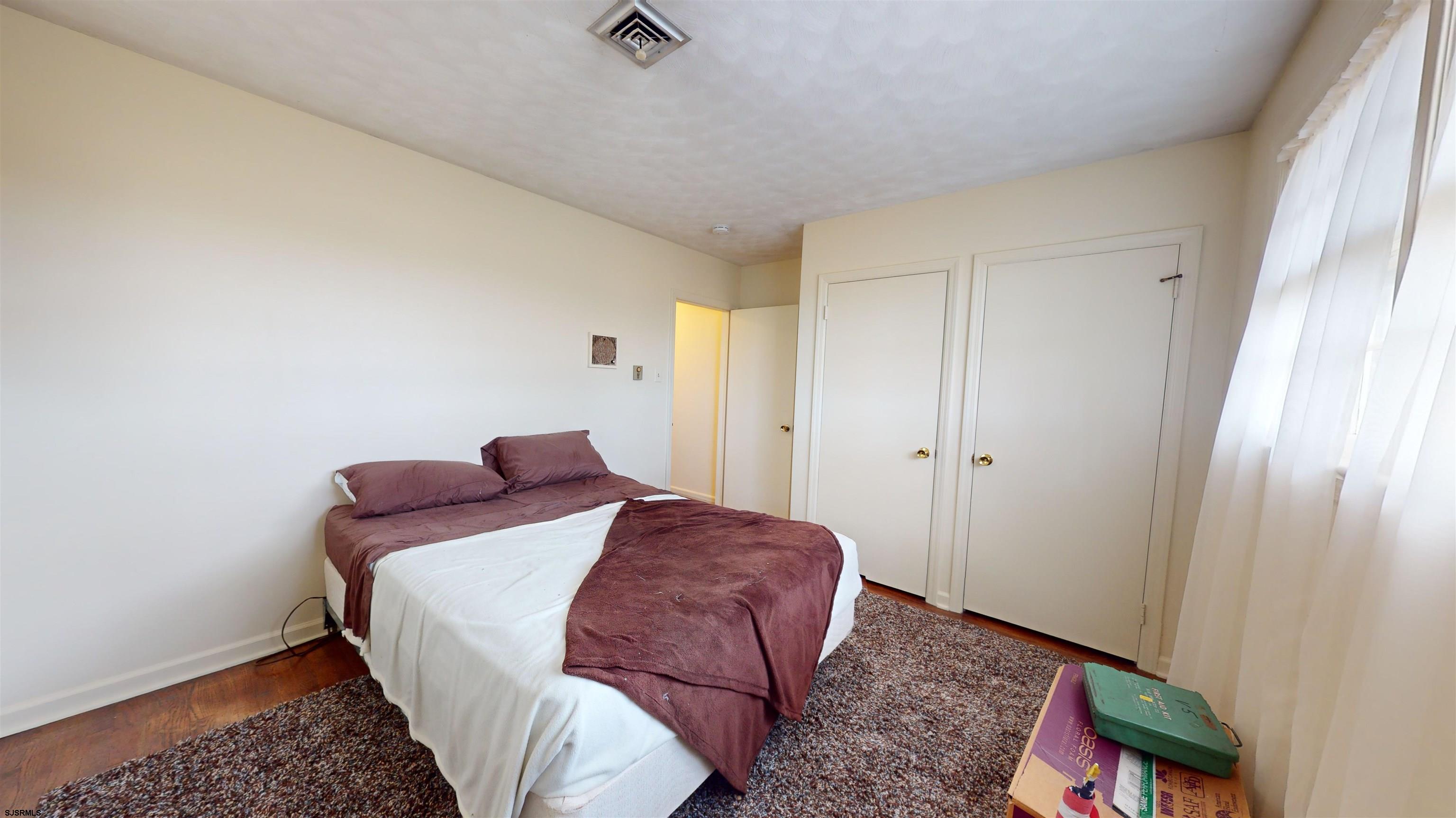 508 Lehigh Road South Glassboro, NJ 08028 - Photo 5 of 24 a bedroom with a bed and wooden floor
