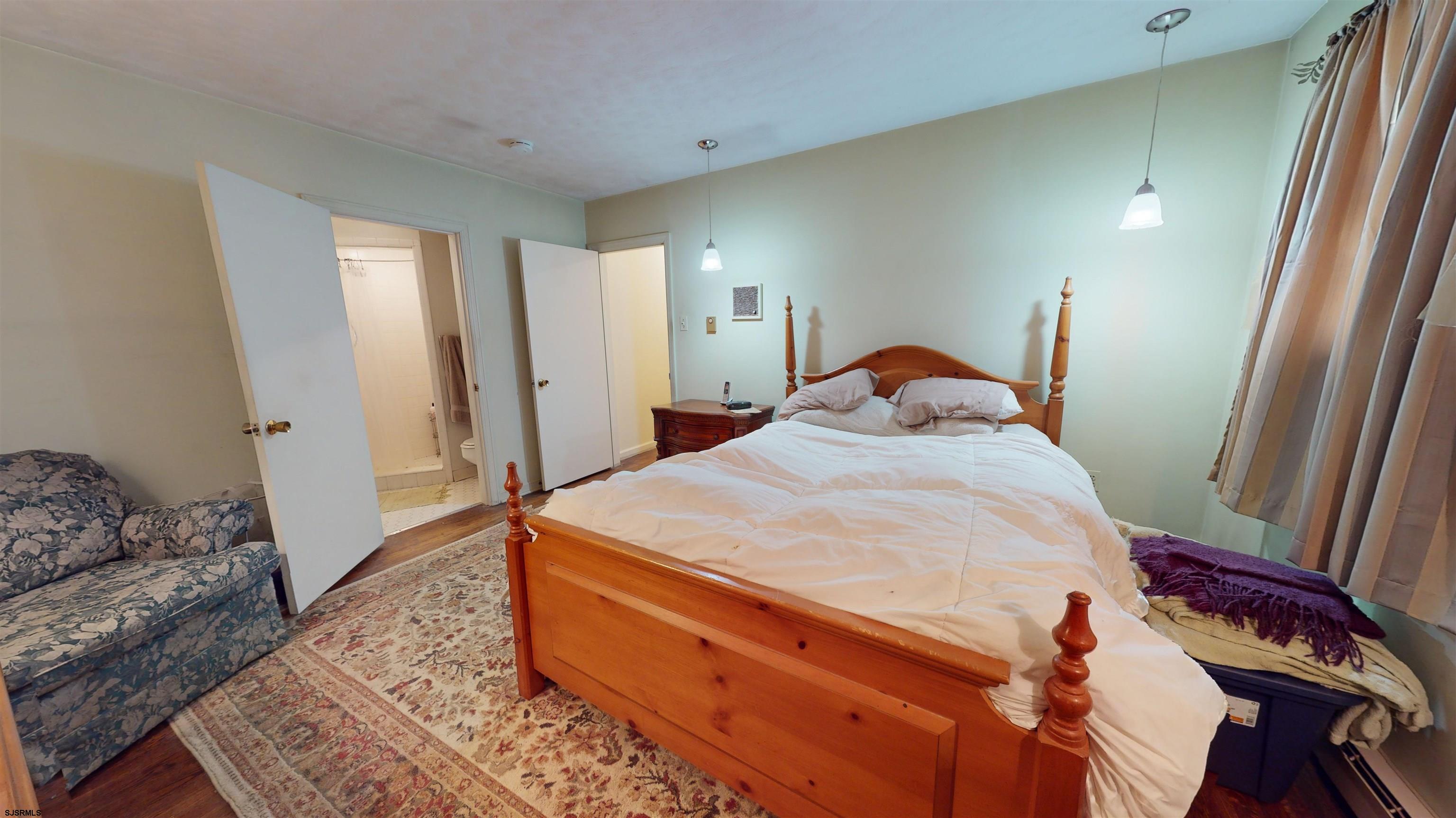 508 Lehigh Road South Glassboro, NJ 08028 - Photo 8 of 24 a bedroom with a bed and wooden floor