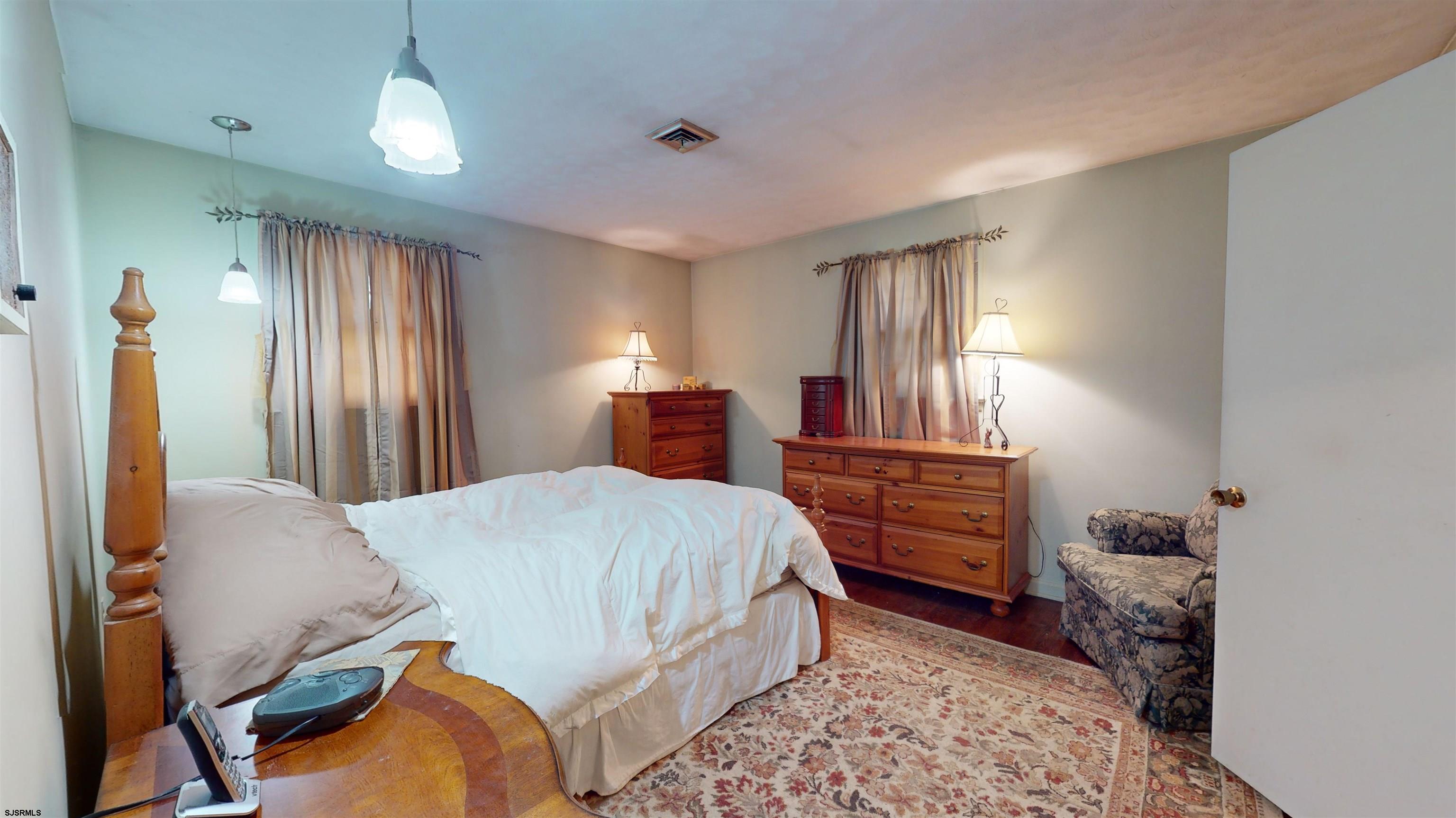 508 Lehigh Road South Glassboro, NJ 08028 - Photo 9 of 24 a bedroom with a bed and wooden floor