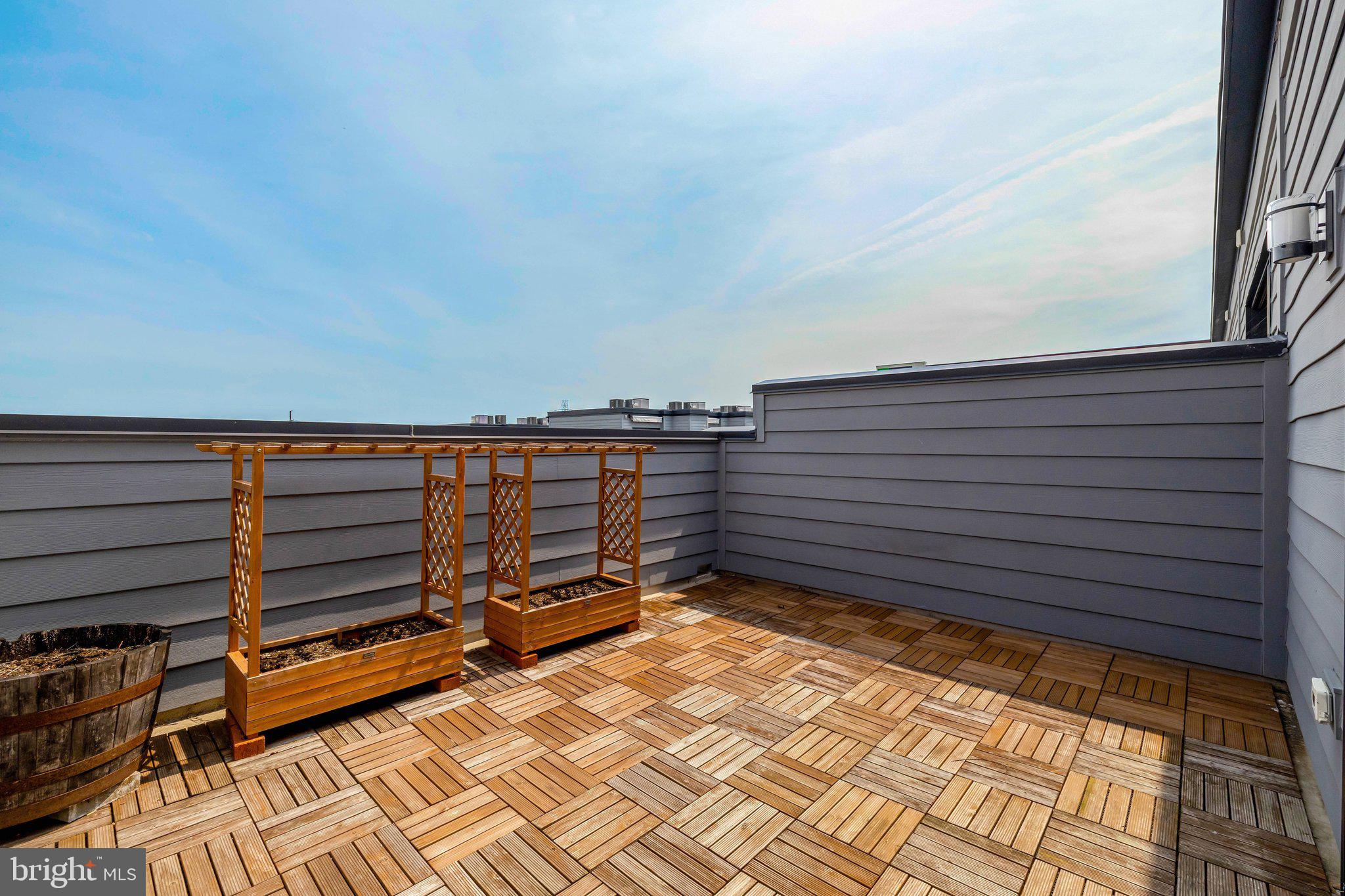 11247 Beaker Street Reston, VA 20190 - Photo 37 of 54 Sunny terrace with wooden planters.