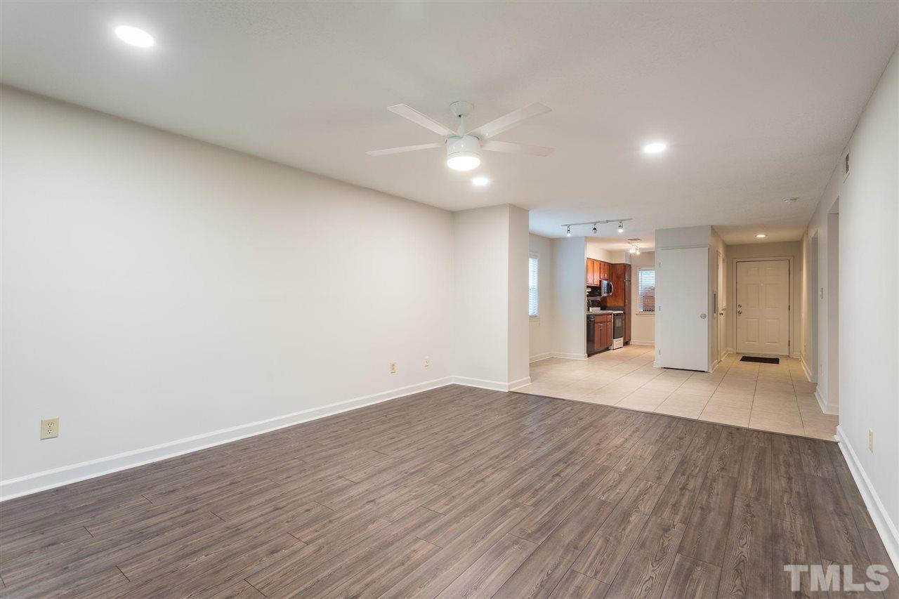 2516 Avent Ferry Road, Unit 101 Raleigh, NC 27606 - Photo 12 of 27 a view of an empty room with wooden floor