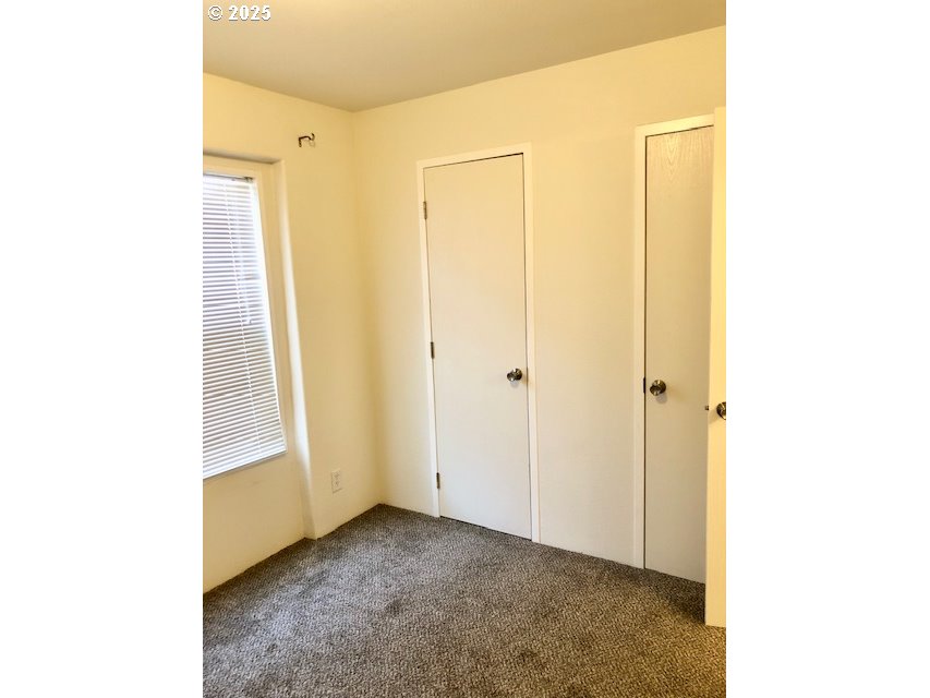 1475 Green Acres Road, Unit 76 Eugene, OR 97408 - Photo 17 of 22 a view of a room with a window and a bathroom