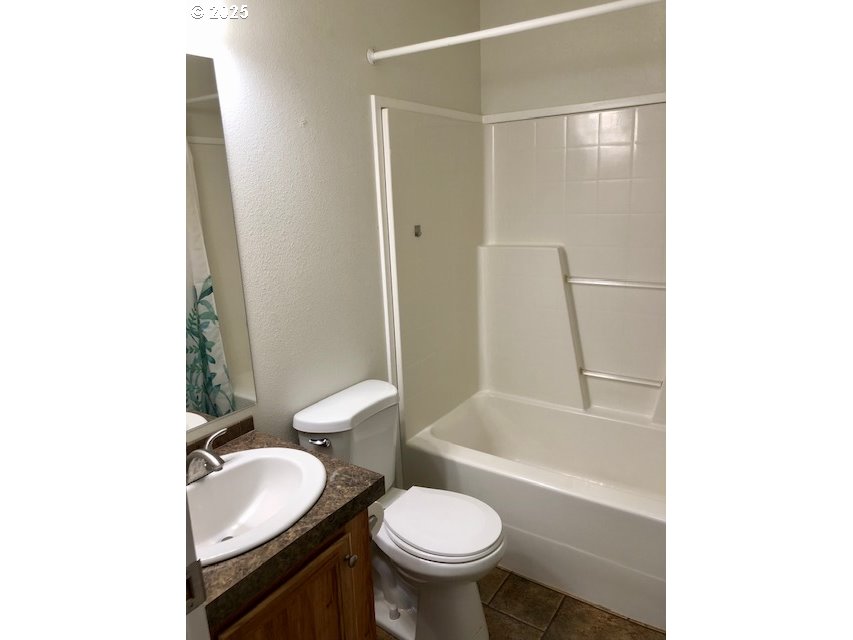 1475 Green Acres Road, Unit 76 Eugene, OR 97408 - Photo 18 of 22 a bathroom with a sink toilet and shower
