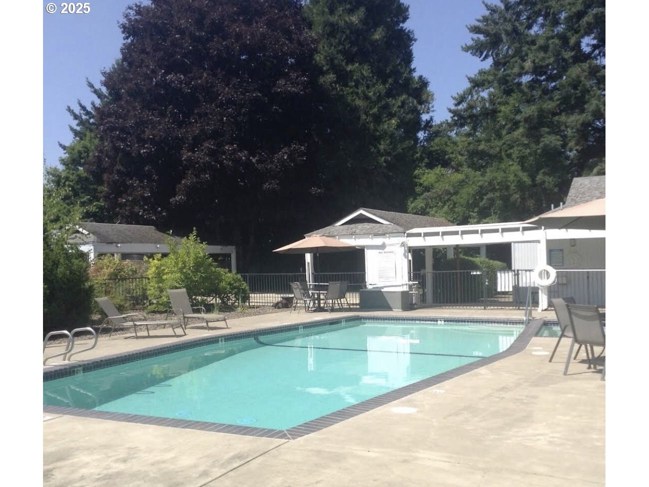 1475 Green Acres Road, Unit 76 Eugene, OR 97408 - Photo 20 of 22 a view of a swimming pool with a patio