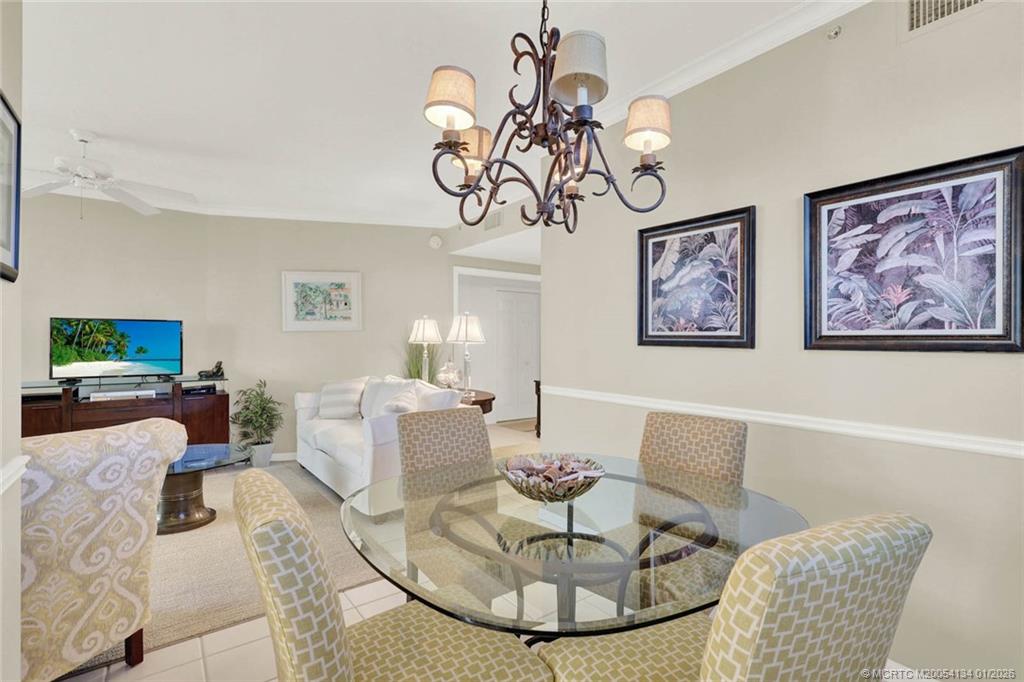 5700 Northeast Island Cove Way, Unit 4301 Stuart, FL 34996 - Photo 16 of 45 a living room with furniture a rug and a table