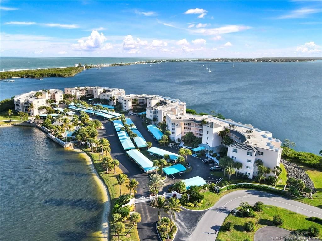 5700 Northeast Island Cove Way, Unit 4301 Stuart, FL 34996 - Photo 2 of 45 a view of a lake with a mountain in the background