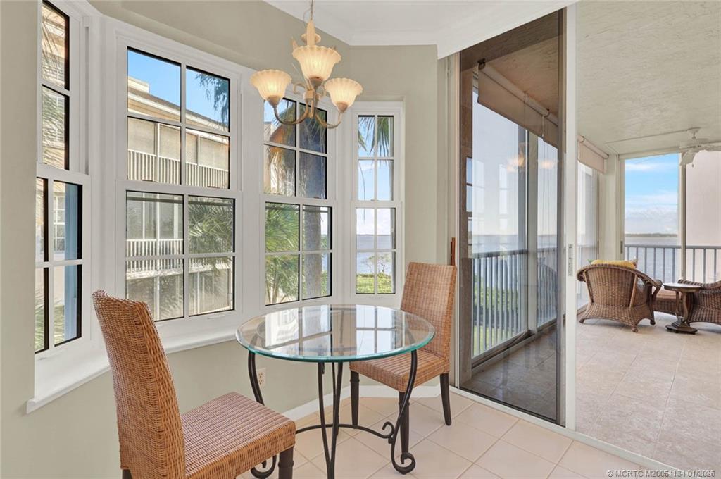 5700 Northeast Island Cove Way, Unit 4301 Stuart, FL 34996 - Photo 21 of 45 a view of a livingroom and dining room