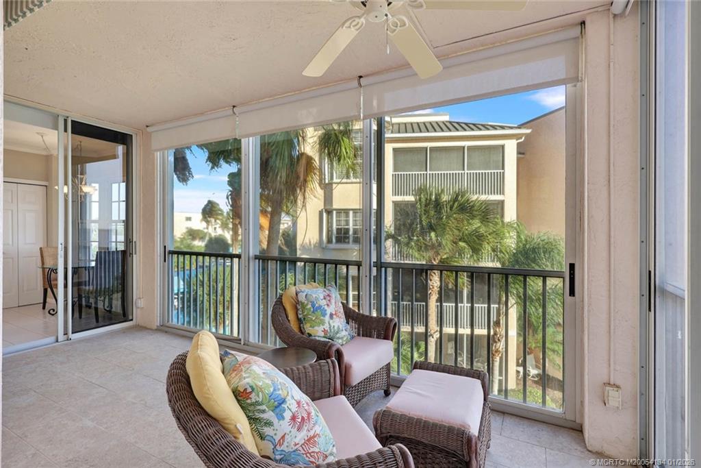 5700 Northeast Island Cove Way, Unit 4301 Stuart, FL 34996 - Photo 25 of 45 a balcony with furniture and a potted plant