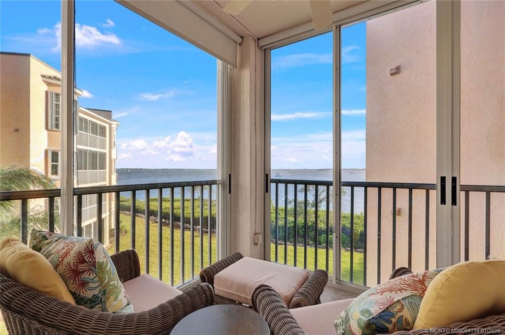 5700 Northeast Island Cove Way, Unit 4301 Stuart, FL 34996 - Photo 26 of 45 a living room with furniture and a large window